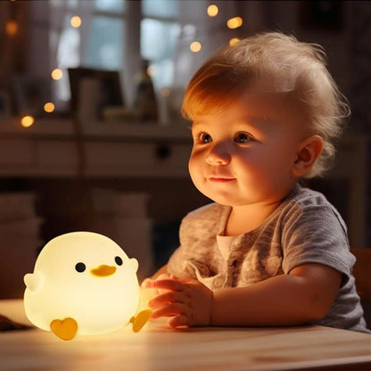 veilleuse bebe canard sur table